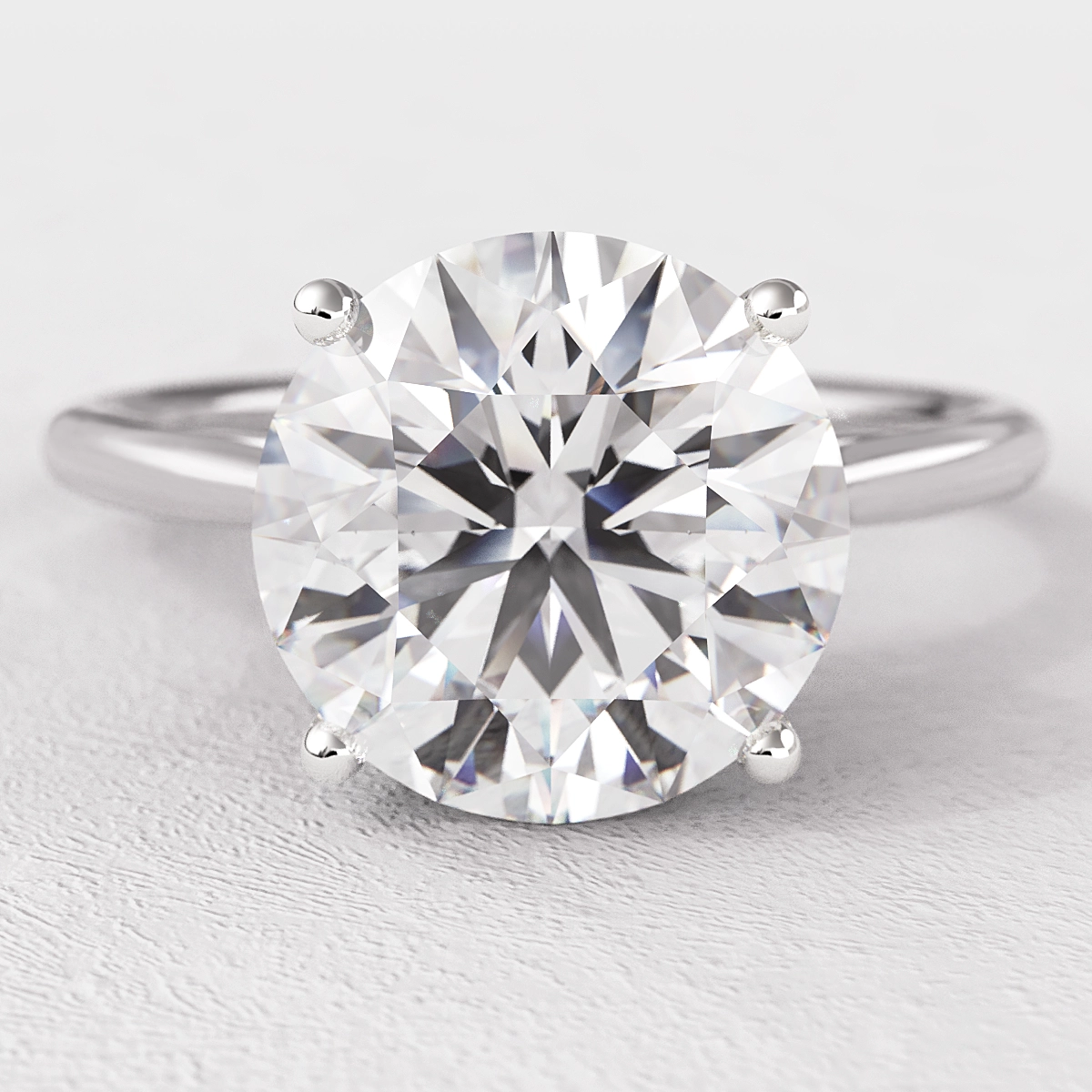 Round Four Claw Tulip Solitaire Diamond Ring