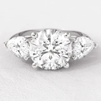 3.0ct round and pear cut trilogy diamond ring on hand tr1060 from Dublin