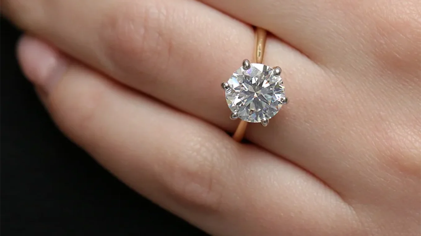 3ct six claw diamond engagement ring on thin yellow gold band on hand sr1025-1