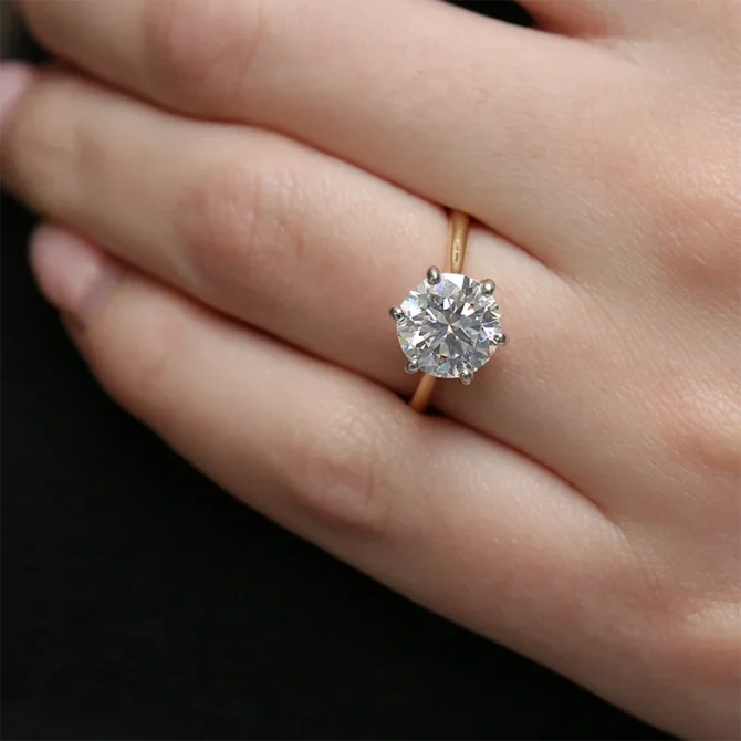 3ct six claw diamond engagement ring on thin yellow gold band on hand sr1025-1