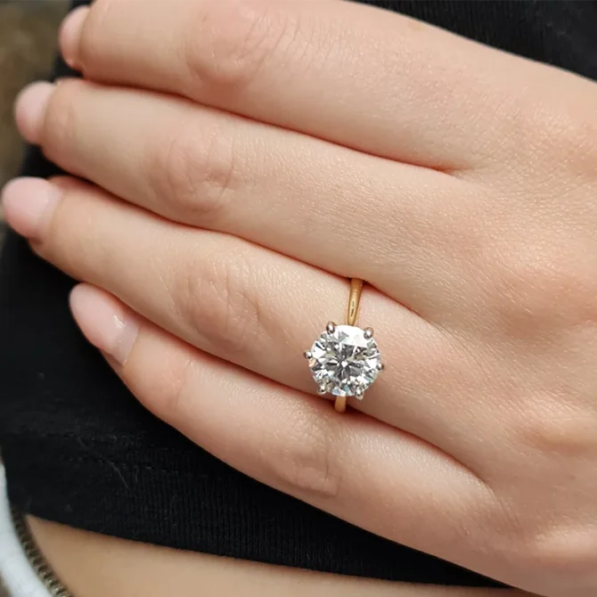 3ct six claw diamond engagement ring on thin yellow gold band on hand sr1025-2