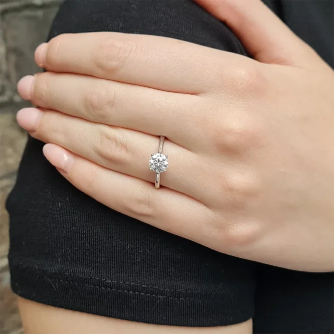 4 claw classic solitaire engagement ring with infinity loop on hand-sr1011-1