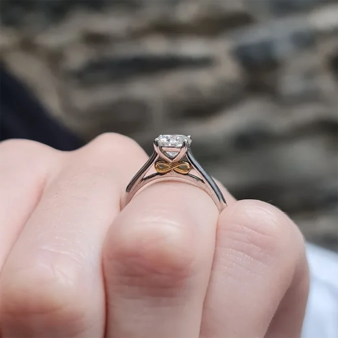 4 claw classic solitaire engagement ring with infinity loop on hand-sr1011-2