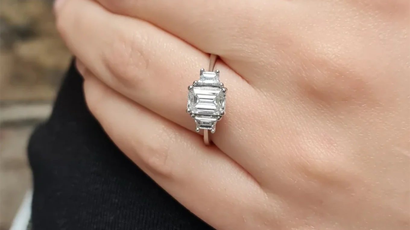 Emerald and Trapezoid Diamond Three Stone diamond Ring on hand TR1012-2