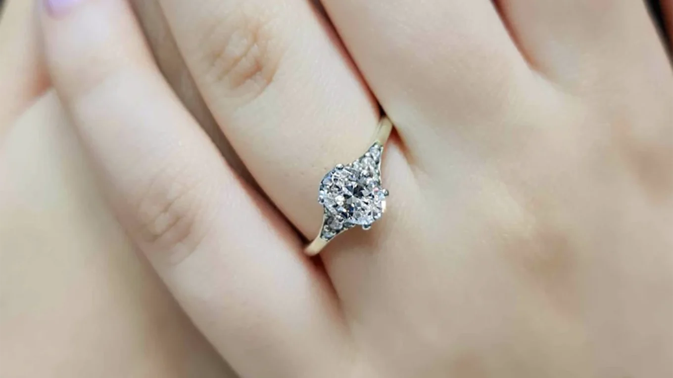 Hand made oval cut diamond engagement ring in yellow gold on hand PR1005