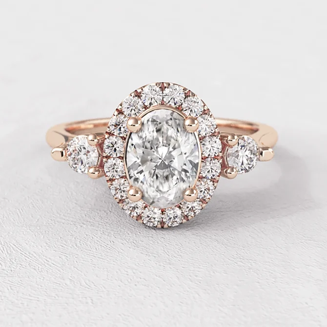 Oval Halo Trilogy Style Engagement Ring VR1100 in rose gold