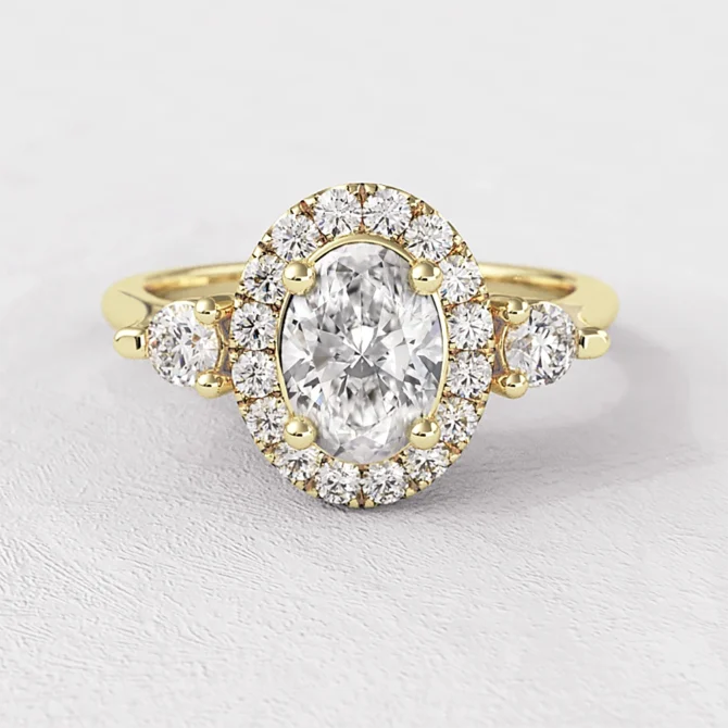 Oval Halo Trilogy Style Engagement Ring VR1100 in yellow gold