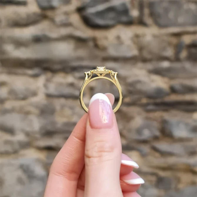 Oval Halo Trilogy Style Engagement Ring VR1100 in yellow gold side view