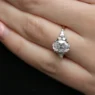 Oval engagement ring with pear and round side diamonds on hand TR1008-1