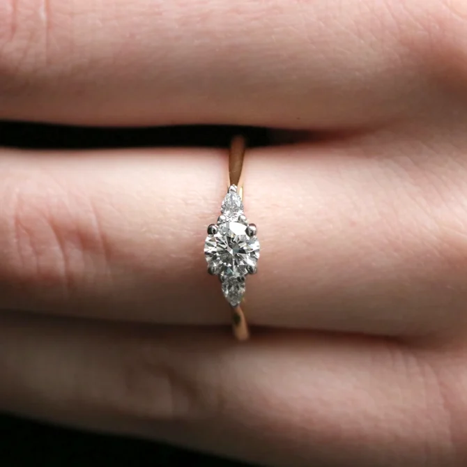 Round Cut Three Stone Diamond Engagement Ring TR1034 on hand in yellow gold