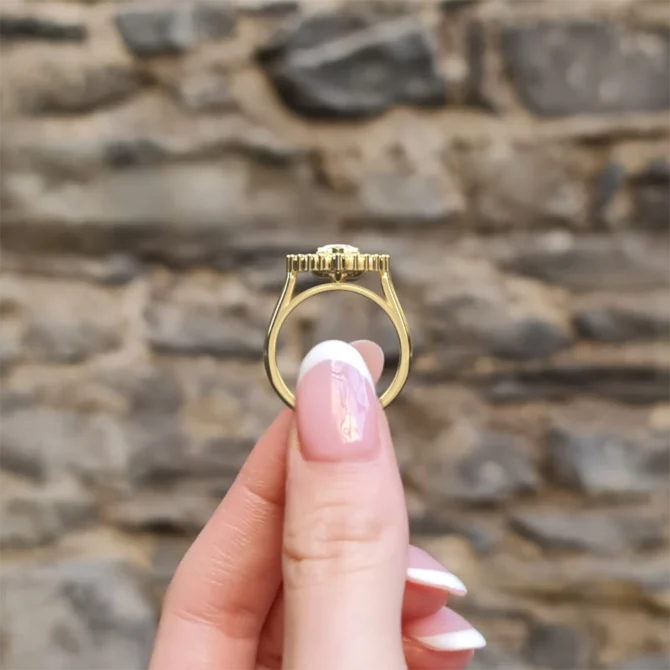 hand holding pear double halo engagement ring vr1108 yellow gold