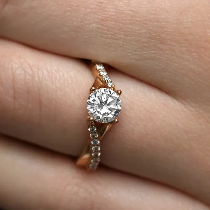 rose gold twist style diamond engagement ring on hand pr1007-1