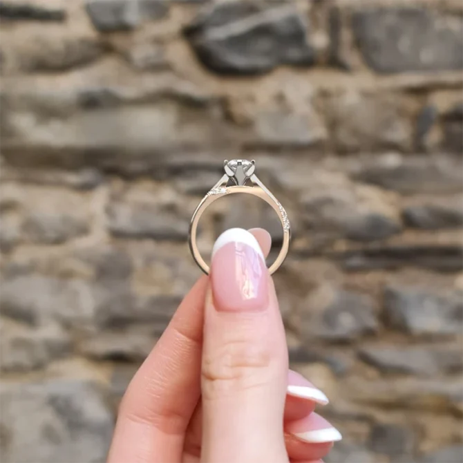 twist style diamond engagement ring with diamonds twist on band in rose gold side view pr1024