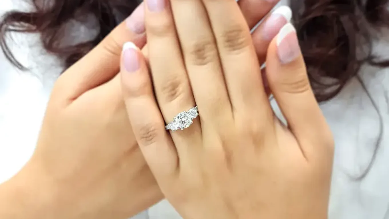 Claw set diamond three stone engagement ring on hand-tr1057-3