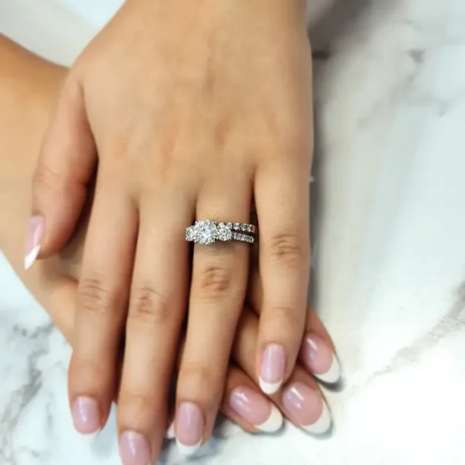 Claw set diamond three stone engagement ring on hand-tr1057-4