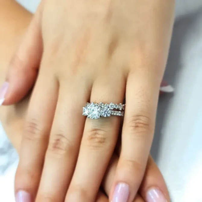 Claw set diamond three stone engagement ring on hand-tr1057-5