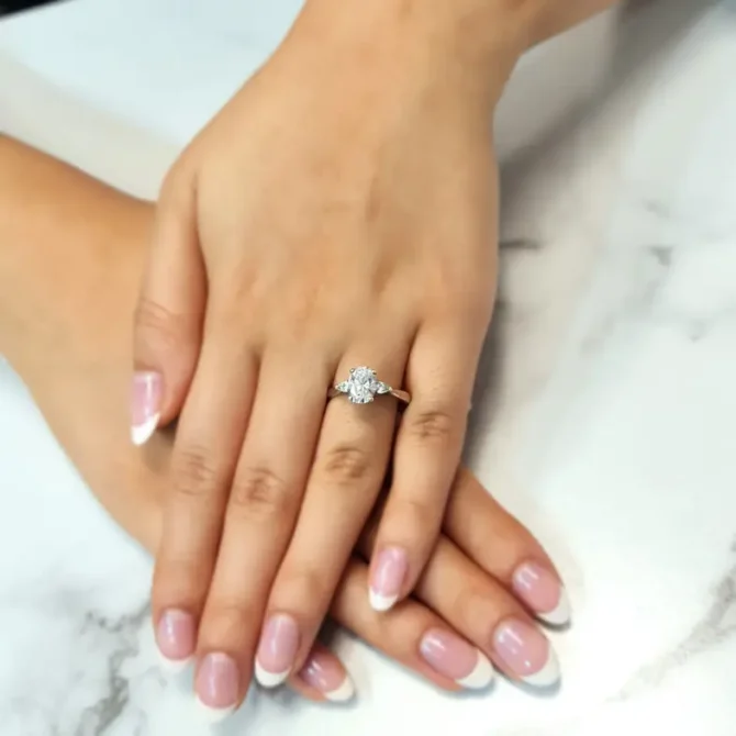 Oval and pear three stone ring on hand-tr1021-1