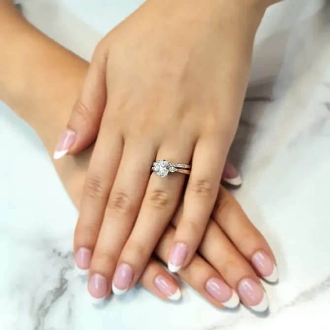 Oval and pear three stone ring on hand-tr1021-5