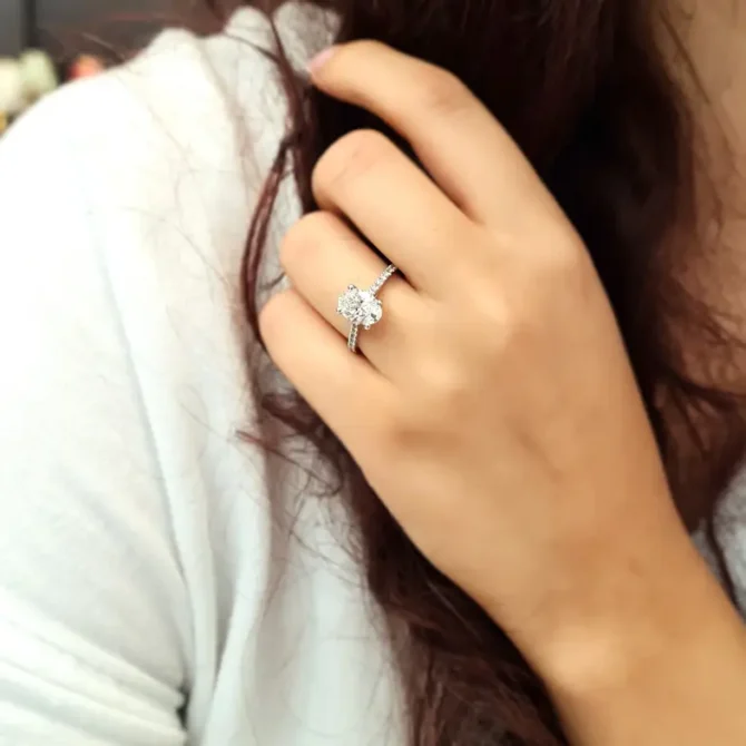 Oval claw set diamond engagement ring on hand-pr2079-3