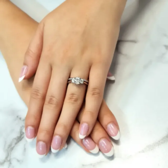 Oval shape trilogy diamond ring on hand-tr1003-4