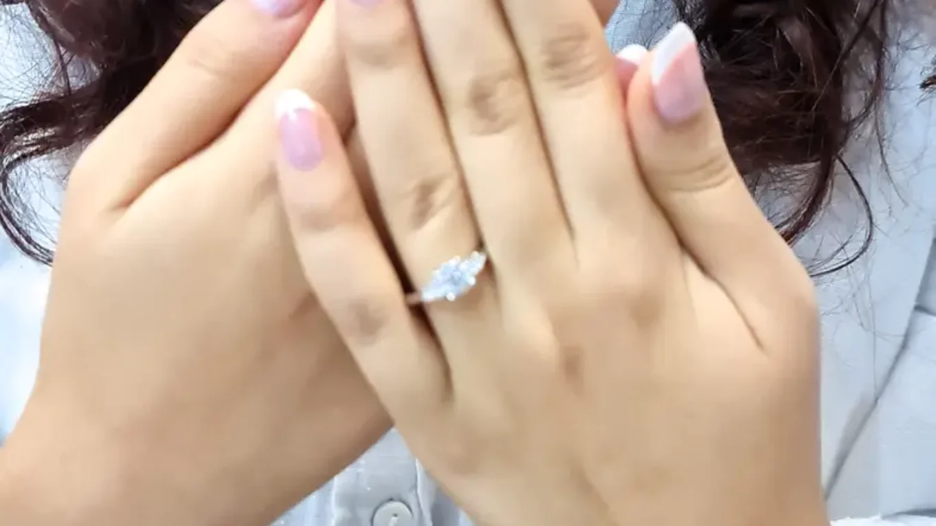 Round and pear shape diamond three stone ring in white gold on hand tr1078 made by Bespoke Diamonds Ireland