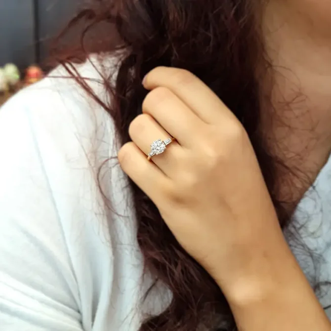 Round and tapered baguette cut three stone ring on hand tr1032 made by Bespoke Diamonds Ireland