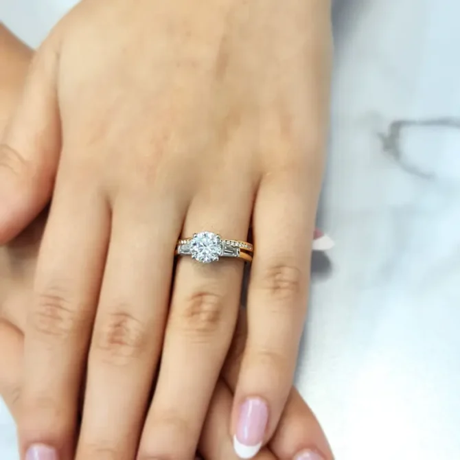 Round and tapered baguette cut three stone ring on hand tr1032 made by Bespoke Diamonds in Dublin Ireland