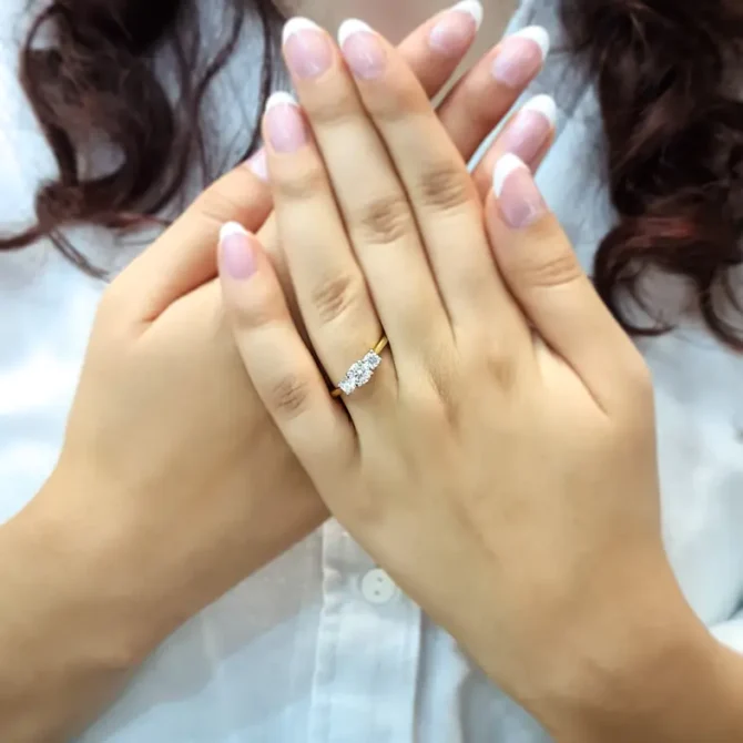 Trilogy diamond ring on hand-tr1020-3