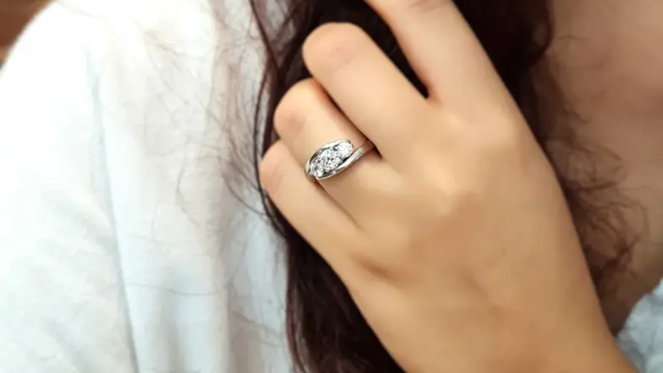 Twist three stone engagement ring on hand in white gold tr1002 made by Bespoke Diamonds Ireland