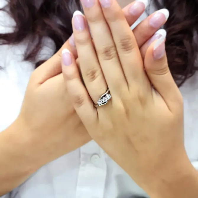 Twist trilogy diamond ring on hand tr1024 made by Bespoke Diamonds in Dublin, Ireland