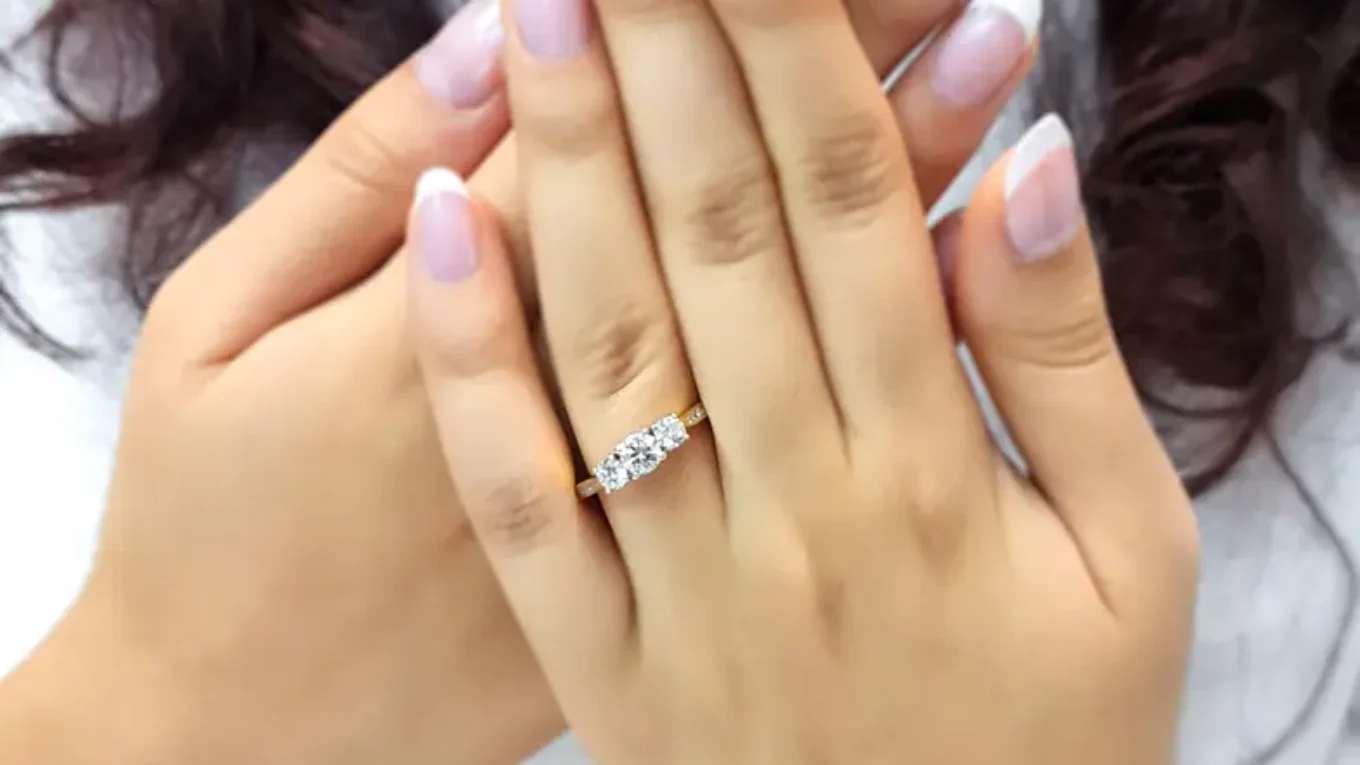 Yellow gold channel set trilogy diamond ring on hand-tr1074-3