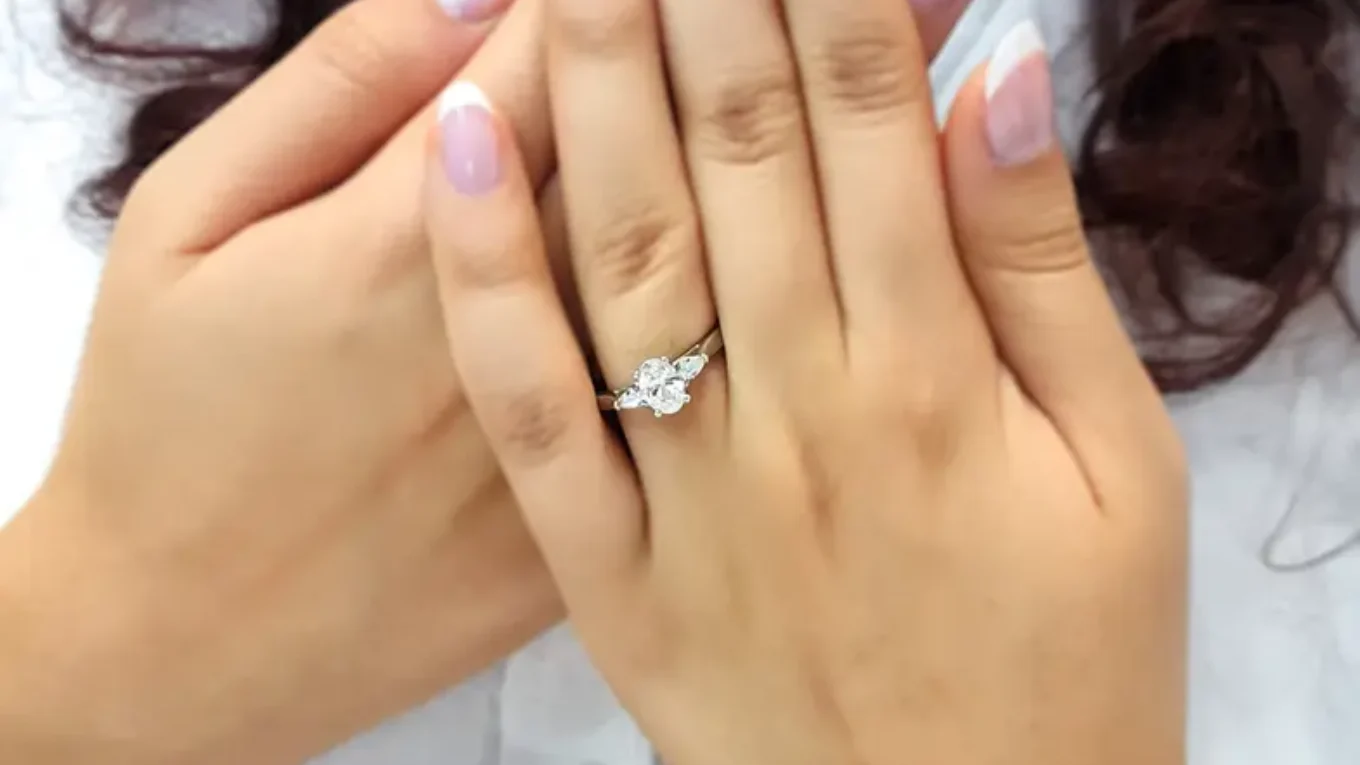 oval and pear cut trilogy style engagement ring in Dublin on hand-tr1080-3