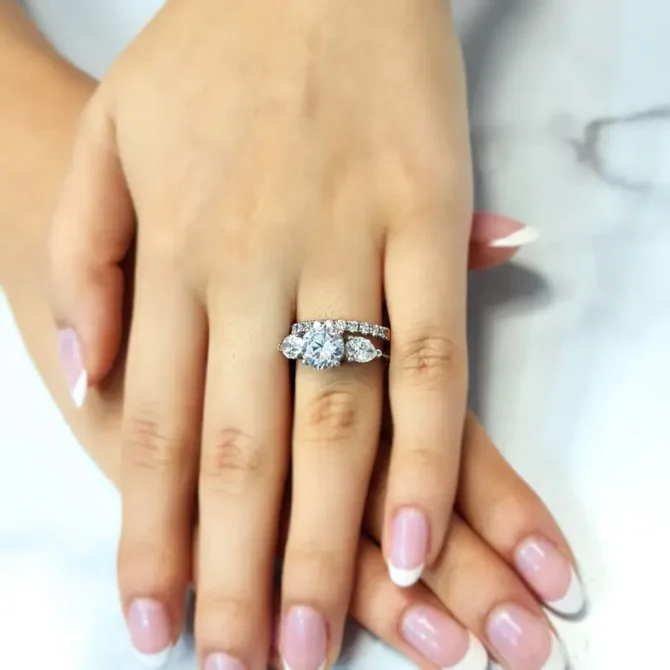 3.0ct round and pear cut trilogy diamond ring on hand tr1060 from Dublin, Ireland