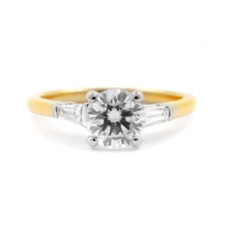 Bespoke designed round and baguette cut three stone diamond engagement ring
