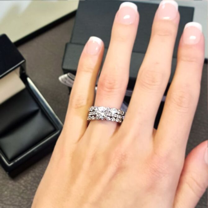 pr1013-side-stone-diamond-engagement-ring-with-wedding-ring-on-hand-image-3