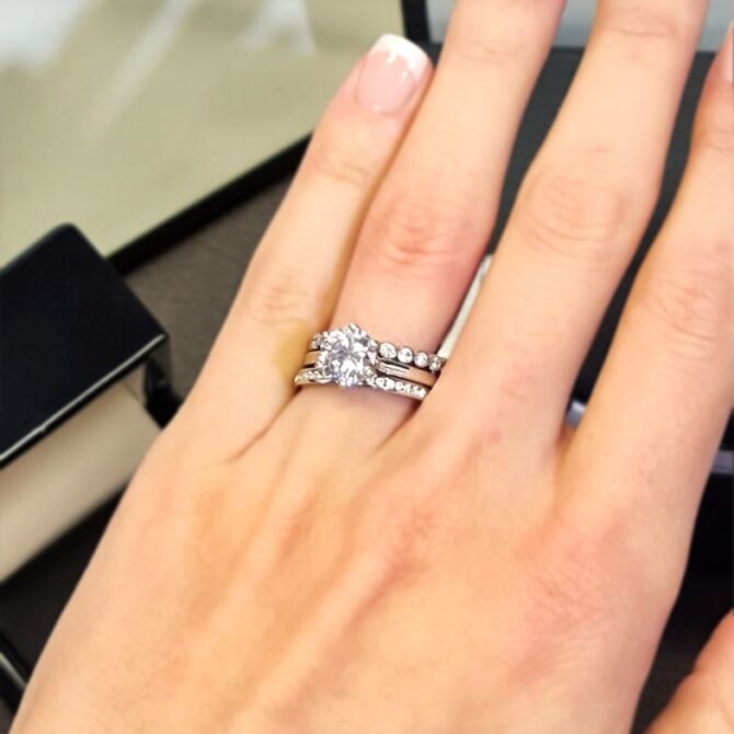 sr1017-six-claw-solitaire-diamond-engagement-ring-with-wedding-ring-on-hand-image-3#