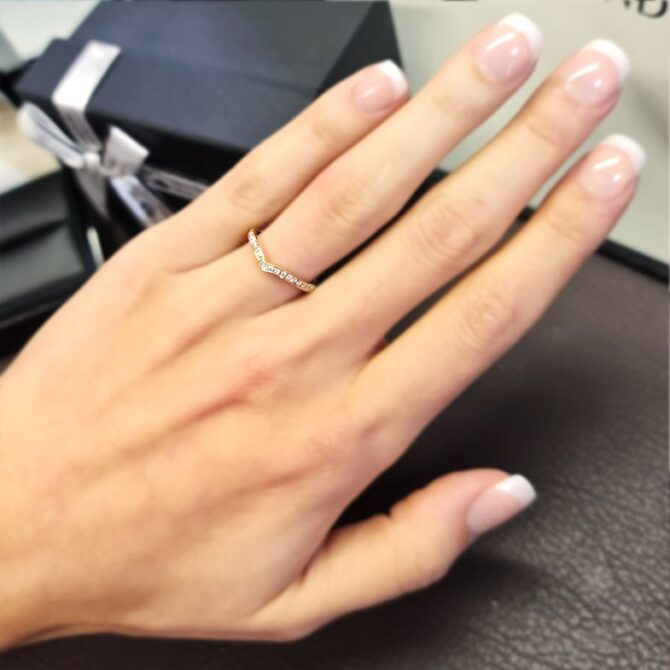 wr051-curved-pave-set-ladies-diamond-wedding-ring-on-hand-image-1