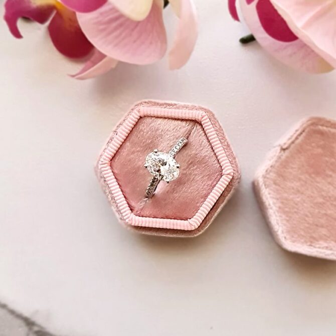 PR1004-oval-cut-diamond-side-stone-engagement-ring-in-box-image-2