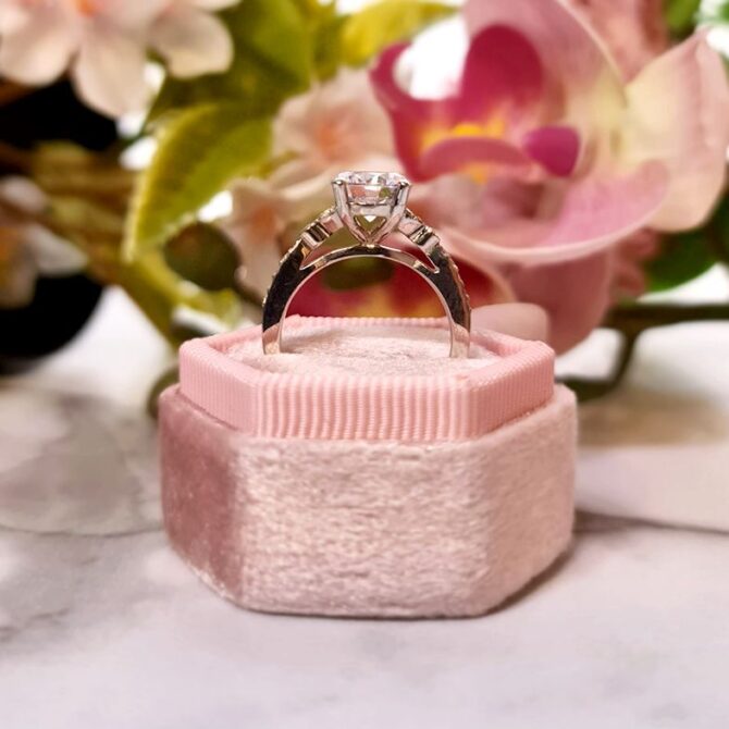 PR1033-round-cut-diamond-side-stone-engagement-ring-in-box-image-1