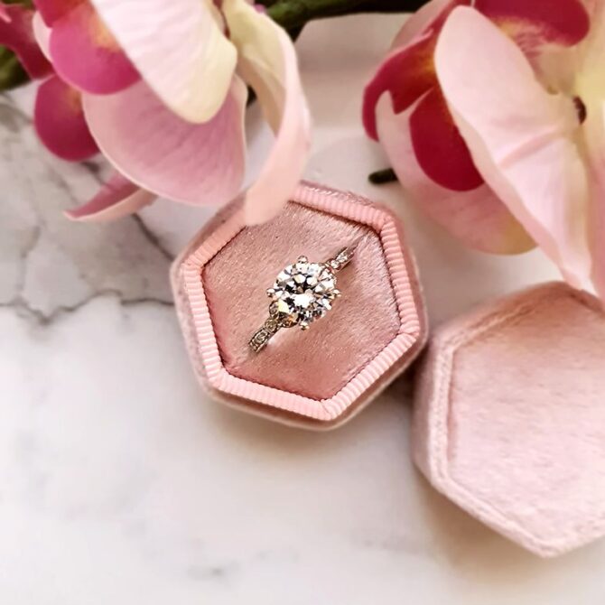 PR1033-round-cut-diamond-side-stone-engagement-ring-in-box-image-2