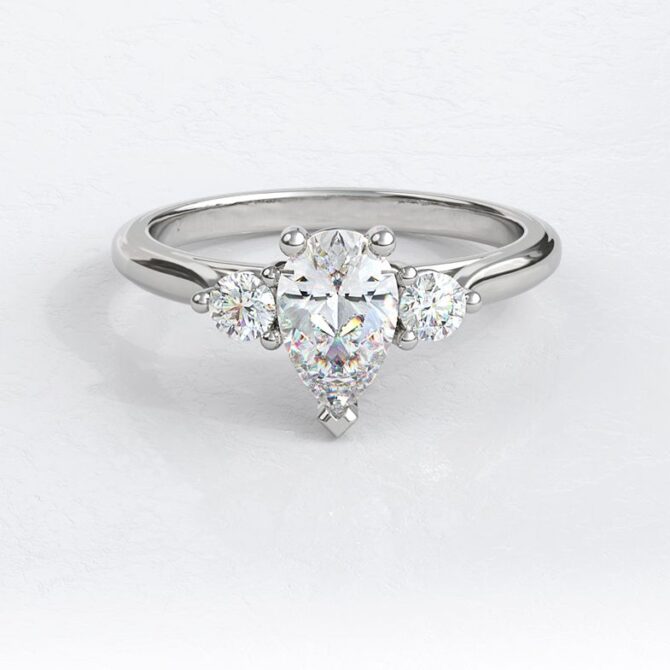 sb1273-bespoke-designed-pear-and-round-cut-diamond-three-stone-ring-image-1