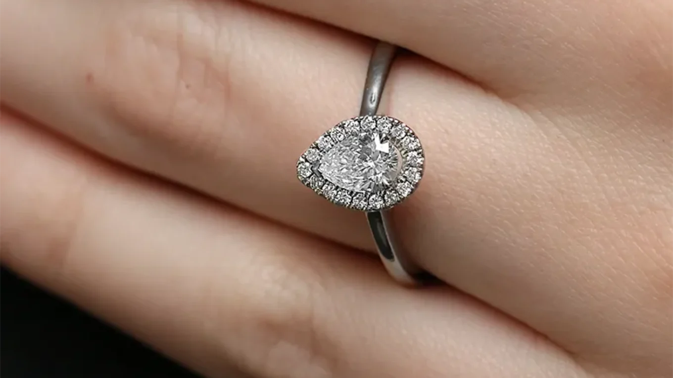 Claw set pear diamond engagement ring on hand VR2094