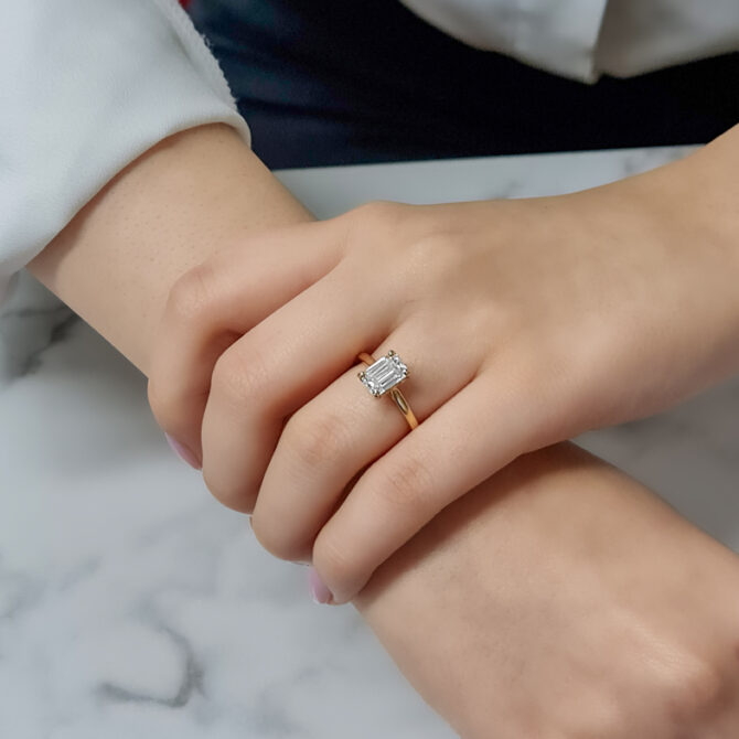 1.67ct Emerald Cut Single Stone Ring SR1018 on hand 3