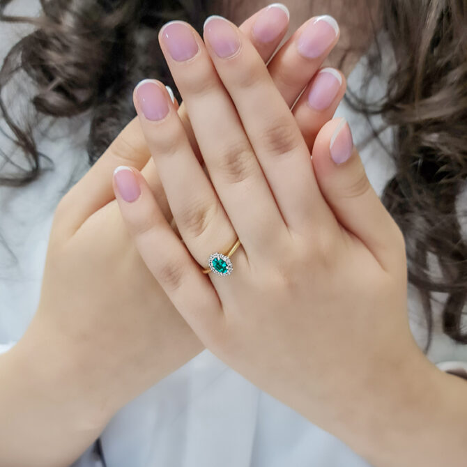 0.85ct Oval Cut Emerald Halo Ring CR1047 on hand 3