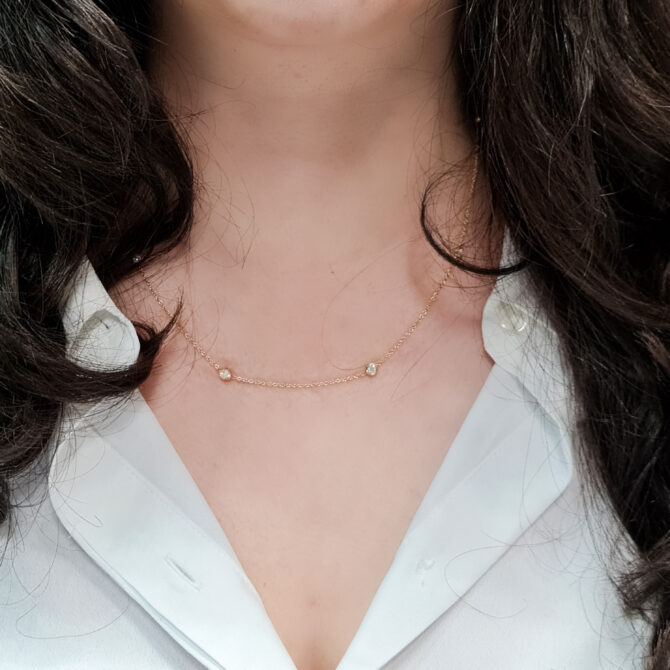 BPN042 18k Yellow Gold 0.70ct Lab Grown Diamond Pendant worn around neck close up