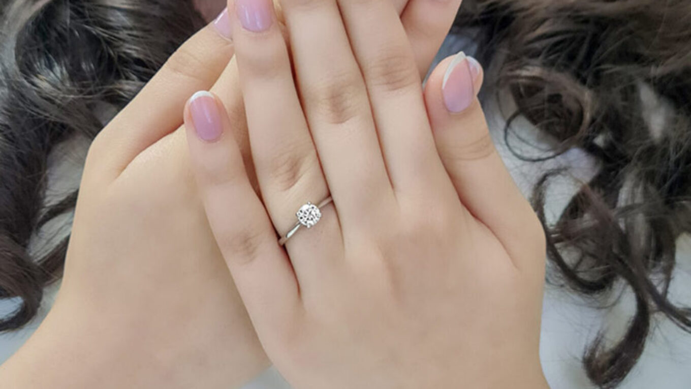 0.60-Carat-Round-Cut-Four-Claw-Tulip-Bespoke-Engagement-Ring-on-hand-image1