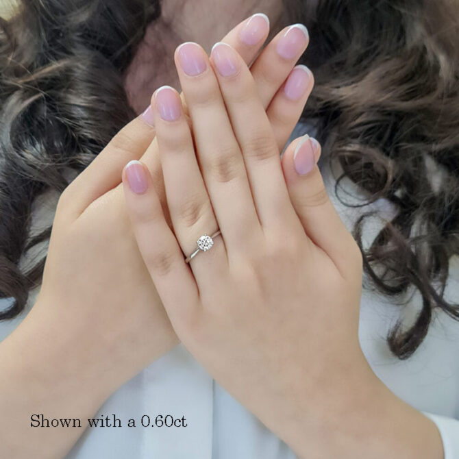 0.60-Carat-Round-Cut-Four-Claw-Tulip-Bespoke-Engagement-Ring-on-hand-image1