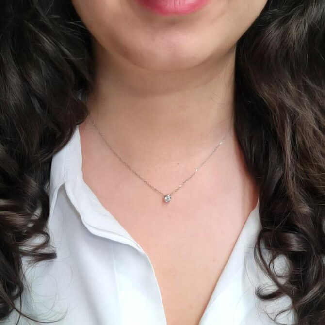 Besel set diamond pendant on person in Ireland pn068