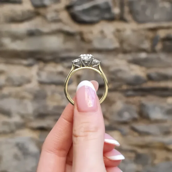 Oval and half moon diamond engagement ring in yellow gold side vide on hand-tr1095