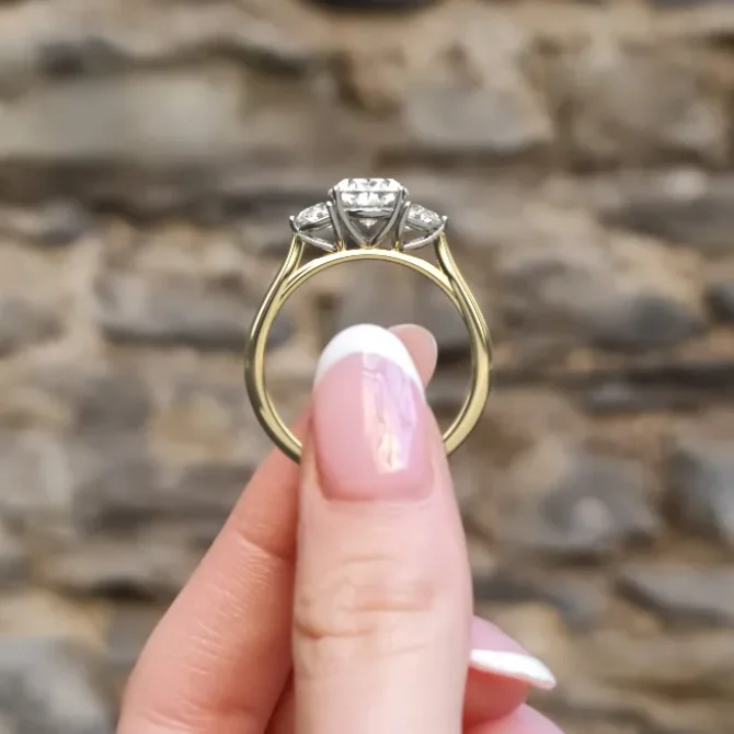 Oval and half moon diamond engagement ring in yellow gold side vide on hand-tr1095